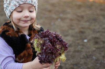 Portrait of girl holding ice cream