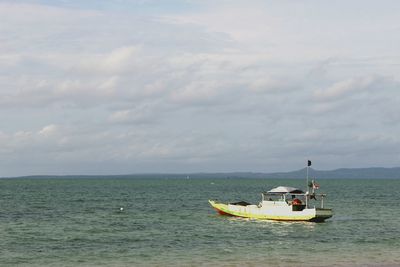 Boat on sea against sky