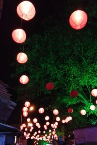 Low angle view of illuminated lantern at night