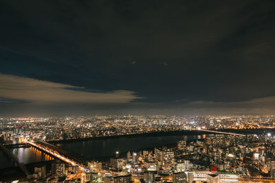 High angle view of illuminated city buildings at night