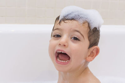 Portrait of boy in bathroom