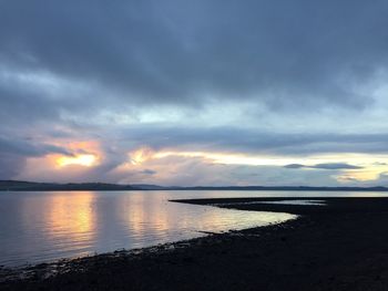 Scenic view of sea against sky at sunset