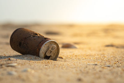 Close-up of rusty metal on beach