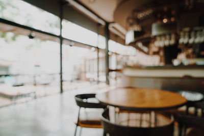 Empty chairs and tables in cafe