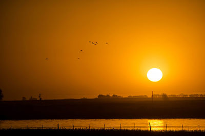 Scenic view of landscape at sunset