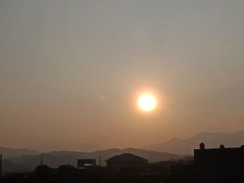 Scenic view of silhouette mountains against sky during sunset