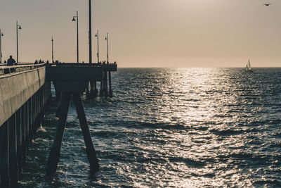 Scenic view of sea against clear sky during sunset