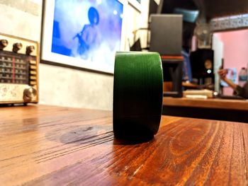 Close-up of wine glass on table at home