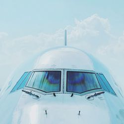 Low angle view of airplane against sky