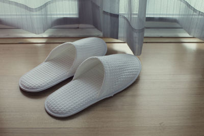 High angle view of shoes on hardwood floor