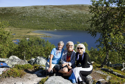 Three senior women hiking