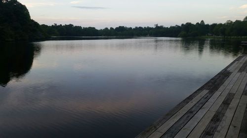 Scenic view of calm lake at sunset