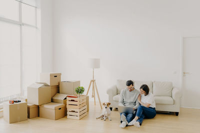 People sitting on wooden floor