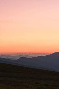 Scenic view of silhouette landscape against sky during sunset