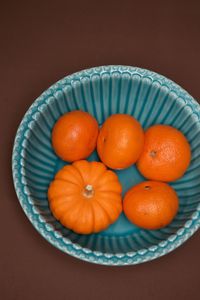 Close-up of orange fruits in plate