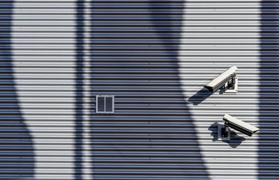 Close-up of electric camera against wall