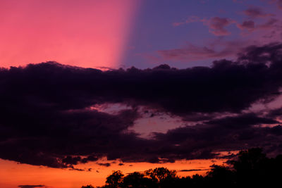 Low angle view of dramatic sky at sunset