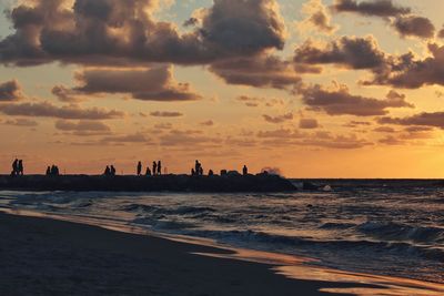 Silhouette of people on beach