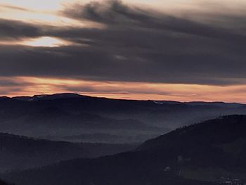 Scenic view of mountains against dramatic sky