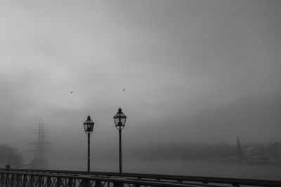 View of street light and bridge against sky