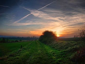 Scenic view of field against sky during sunset