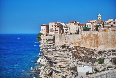 Scenic view of sea against clear blue sky