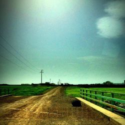 Road passing through field