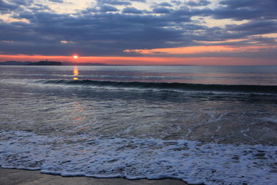 Scenic view of sea against sky during sunset