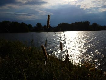 Scenic view of lake against sky during sunset