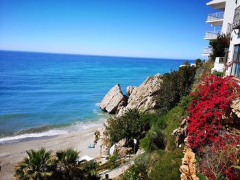 Scenic view of sea against clear blue sky