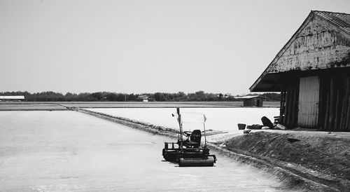 People on boat against clear sky