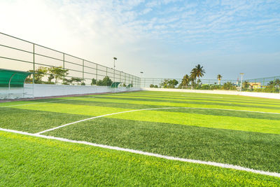 Scenic view of soccer field against sky