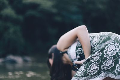 Close-up of woman standing on bench