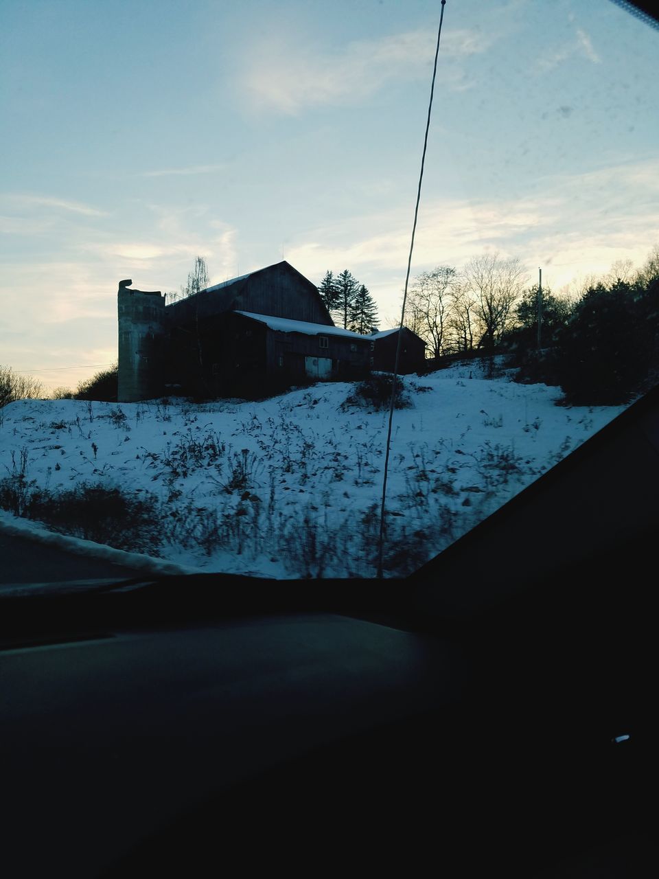 SNOW COVERED HOUSES AGAINST SKY