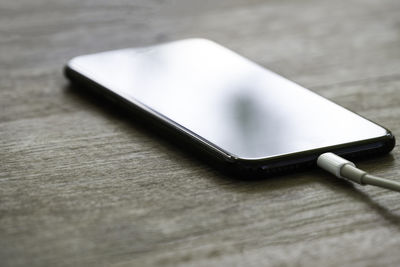 High angle view of mobile phone on table