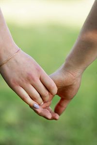 Midsection of man holding hands