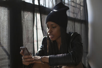 Young woman using mobile phone