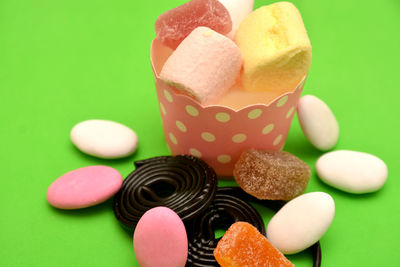 Close-up of multi colored candies on table