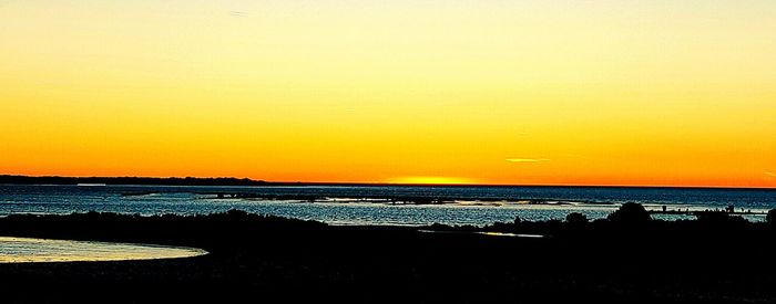 Scenic view of sea at sunset