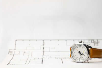 Close-up of clock on table