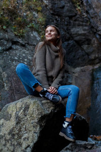 Nice girl traveler at the mistyc waterfall