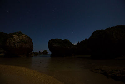 Scenic view of sea against sky at night