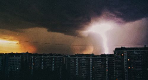 Dramatic sky over city at sunset