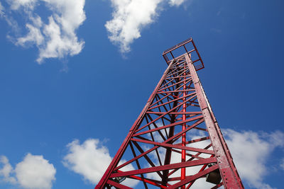 Low angle view of crane against blue sky