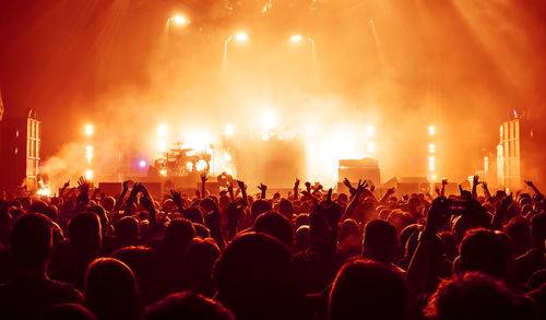 View of crowd at illuminated music concert