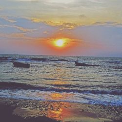 Scenic view of sea at sunset