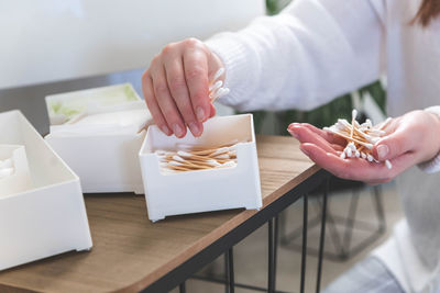 Cropped hand of man preparing food