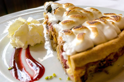 Close-up of sweet pie in plate at table