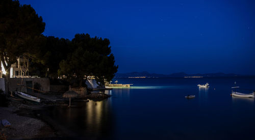 Scenic view of sea against sky at night