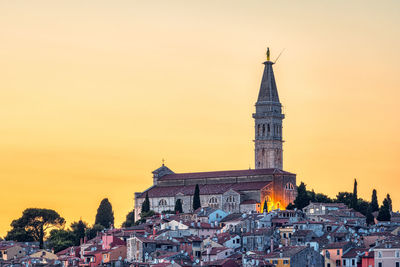 The old town of rovinj in croatia with the iconic saint euphemia church at sunset